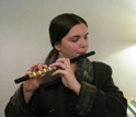 Photo of woman playing a  Japanese flute.