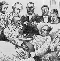 A group of men, one working with a machine, surrounding a patient in bed