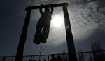 A youth exercises in this February 18, 2009 file photo. REUTERS/Danish Ismail