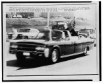 the car carrying the wounded JFK speeding away