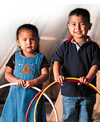 Picture of a boy and girl with hula hoops.