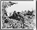 Marines Wait at Entrance to Cave in Which Japanese Soldiers Are Hiding