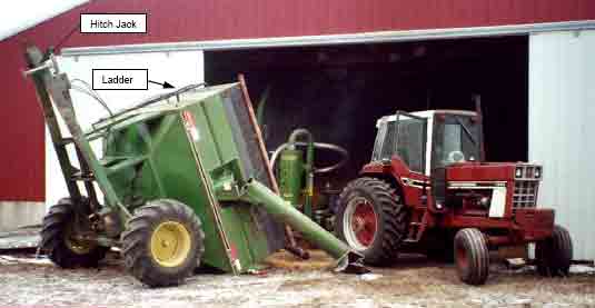 tractor, grain vacuum, and the tipped grain cart