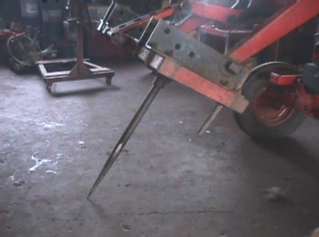 Figure 2.  Factory installed end-loader attachment and after market bale spike.