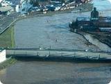Aerial view of bridge during flood.