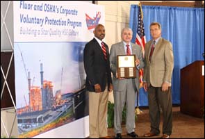Deputy Assistant Secretary Donald G. Shalhoub (center) recognizes Fluor Corporation as a VPP Corporate participant