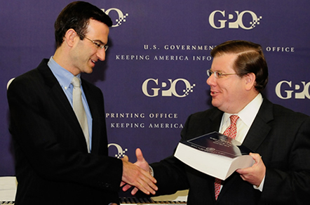Director Orszag receives the FY 2010 Budget from Government Printing Office