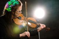 Photo of a musician playing a violin.