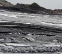 Lava consisting of carbon dioxide-laden carbonatites erupts from Oldoinyo Lengai volcano.