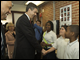 Secretary Duncan, along with Maryland State School Superintendent Nancy Grasmick (in background), meets with students at Doswell Brooks Elementary School in Capitol Heights, Md.