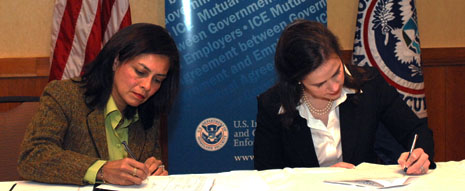 AS Julie Myers signing agreement