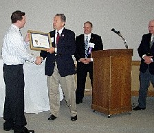 Neil Bower receiving Export Achievement Award from Congressman Herger