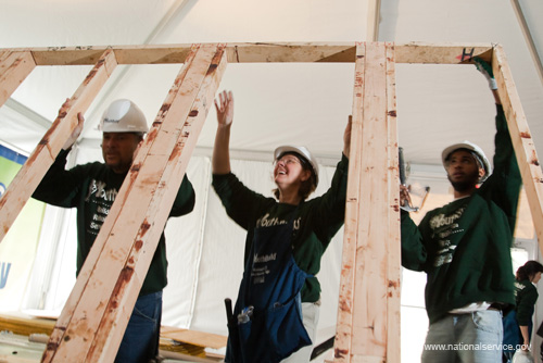 YouthBuild AmeriCorps members and volunteers build a house on the National Mall in Washington, DC.  On March 17th, 2009, YouthBuild U.S.A. held an event in celebration of their 30th anniversary which was attended by First Lady Michelle Obama, Senator John Kerry, Martin Luther King III, Alan Solomont (Chair of the Corporation's Board of Directors), and Corporation Acting Director Nicola Goren.