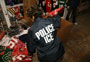 ICE agent sorting counterfeit NFL goods