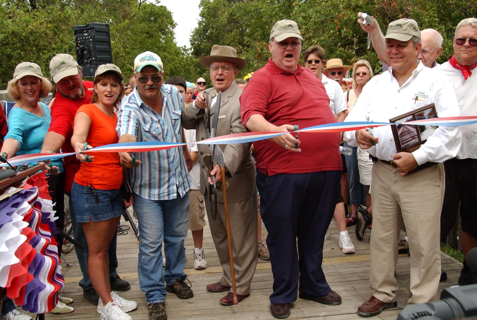 Image of a celebratory ribbon cutting on the Frisco Highline Trail in Missouri. Photo Courtesy Lori Tack.