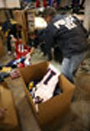 ICE agent sorting counterfeit NFL goods