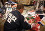 ICE agent sorting counterfeit NFL goods
