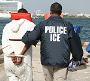 Photo of ICE agent arrest crew member during Caribbean Corridor Initiative operation