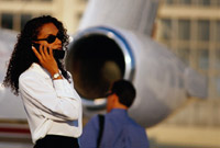 Lady talking beside plane