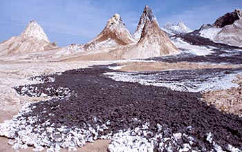 Carbonatite lava that erupted a week before this photo was taken flows from Oldoinyo Lengai volcano.