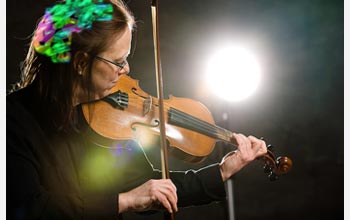 A photo of a violinist practicing.