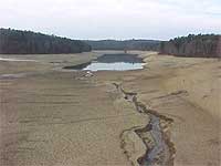 photo of a reservoir with most of the water dried out