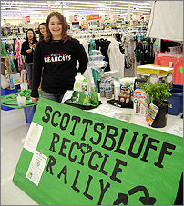 Scottsbluff High School student Elizabeth Turnbo with a sign that says Scottsbluff Recycle Rally