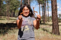 A Paiute youth proudly displays split-twig willow  Photo by Scott Sticha, BLM.