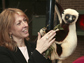 Photo of Duke University Lemur Center director Anne D. Yoder with a Coquerel's Sifaka.