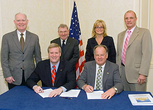 (L to R, sitting) Edwin G. Foulke, Jr., then-Assistant Secretary, USDOL-OSHA; Paul Mikkola, President, AFS. (L to R, standing) Tom Slavin, Manager, Safety and Health, Navistar International Corporation; Jack Wymer, Vice President, Fairmount Minerals; Stephanie Salmon, AFS, Washington DC Office; Fred H. Kohloff, Director, Environmental, Safety and Health, AFS; at the national Alliance renewal signing on April 11, 2008.