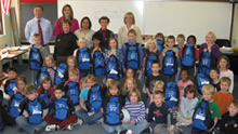Children show off their new backpacks with special thanks to the Upper Mississippi River National Wildlife Fishery and Refuge (NWFR)