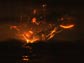 Photo of lightning in the clouds around a volcanic plume.