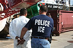 Photo of ICE agent arrest crew member during Caribbean Corridor Initiative operation