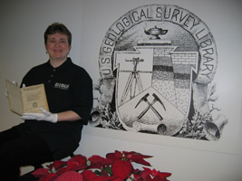 Erin Donnelly of the USGS Library holds an extremely rare 19th century book on gems and precious stones from India.