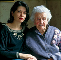 Younger woman and older woman seated together