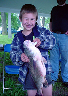 Boy holding fish