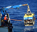 Jason is lifted from the ocean after a dive.