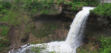 Water spills over the lip of Minnehaha Falls.