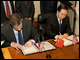 Secretary Arne Duncan and Chinese Education Minister Zhou Ji sign two documents of cooperation in education between the Chinese Ministry of Education and the U.S. Department of Education.