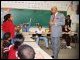 Secretary Paige answers questions from fourth grade students at Skinner Magnet Center in Omaha, Nebraska, on March 24, 2003.
