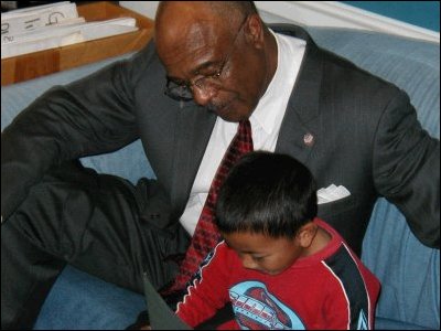 Secretary Paige reads with a student at Kit Carson Elementary School.