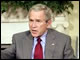 President Bush and Secretary Spellings meet with reporters in the Oval Office at the White House to discuss the Nation's Report Card.  White House photo by Eric Draper