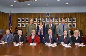 (L to R, sitting) John A. Sofranko, Executive Director, AIChE; Arthur E. Dungan, President, CI; Susan Parker Bodine, Assistant Administrator, Assistant Administrator, Office of Solid Waste and Emergency Response, EPA; Edwin G. Foulke, Jr., former-Assistant Secretary, USDOL-OSHA; Scott Berger, Director, CCPS; Susan Yashinskie, Vice President, Member Relations and Development, NPRA; (L to R, standing) Joseph Acker, President, SOCMA; Madeleine Jacobs, Executive Director, ACS; Tom Gibson, Senior Vice President, ACC; Red Cavaney, President and CEO, API; sign a national Alliance.