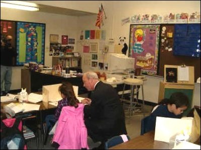 Dr. Hickok reads with a Sylvania Heights Elementary School student.