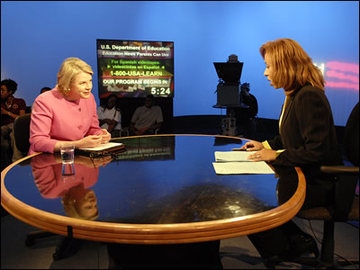 Secretary Spellings responds to a question from moderator Doris McMillon on the set of the Department of Education's television program, Education News Parents Can Use.