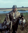 Hunter with Sandhill Cranes/Mallards - credit,  USFWS