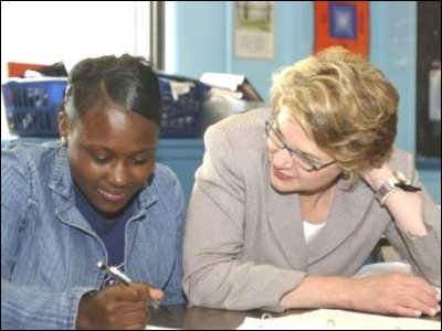 Secretary Spellings works with a student at J.E. Burke High School in Boston, Massachusetts.