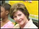Secretary Spellings and First Lady Laura Bush talk with students at Avon Avenue Elementary School in Newark, New Jersey, where Mrs. Bush announced a Striving Readers grant to Newark Public Schools.  White House Photo by Shealah Craighead