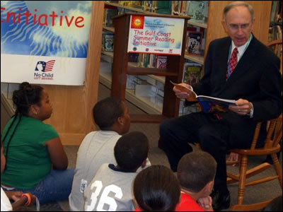 Deputy Secretary Ray Simon reads to students at Beaumont Public Library in Beaumont, Texas.  His visit was part of the U.S. Department of Education's No Child Left Behind Gulf Coast Summer Reading Initiative with First Book.