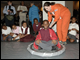 Experts from the Challenger Learning Center in Alexandria, Virginia, demonstrate the hovercraft for fifth- and sixth-grade students from Amidon Elementary School in Washington, D.C.